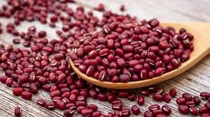 Red beans on wooden spoon
